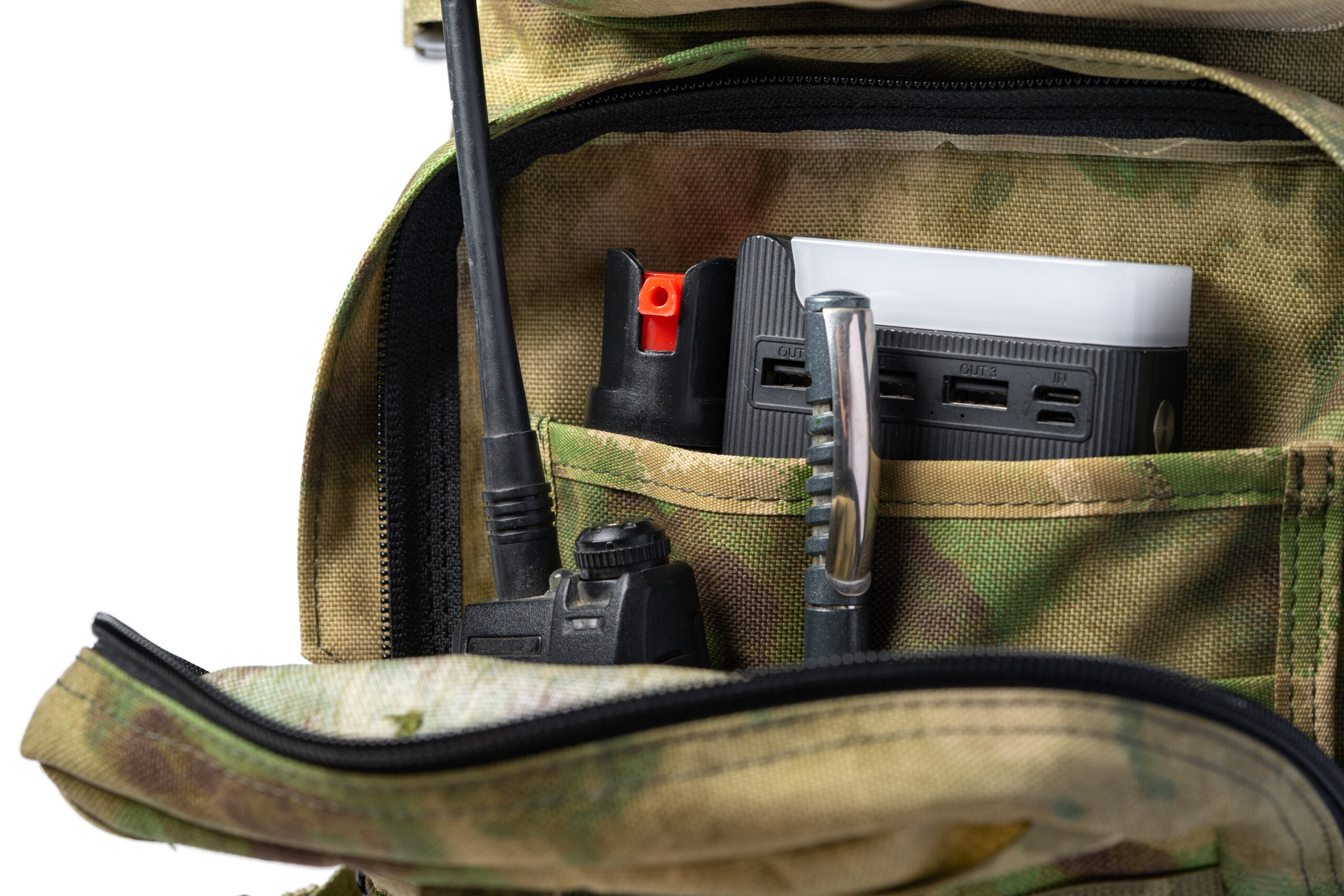 Home open military backpack of khaki color on a white background